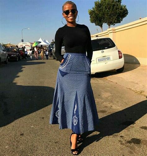tswana lady in beautiful a line shweshwe skirt with pockets and black top clipkulture setswana