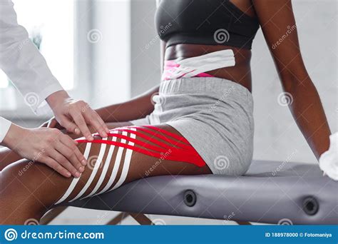Kinesiology Taping Physiotherapist Applying Kinesiology Tape To