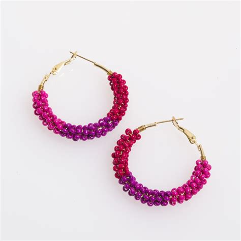 These Earrings Are Intricately Crafted With A Mix Of Berry Colored Seed