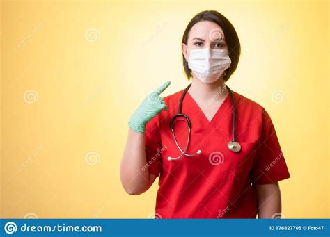 Beautiful Woman Doctor With Stethoscope Wearing Red Scrubs Wears A