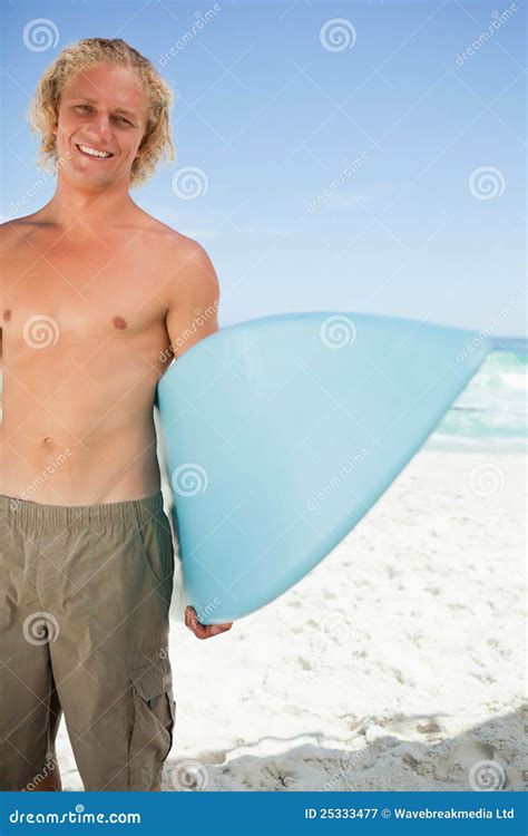 Young Smiling Man Holding His Blue Surfboard Stock Image Image Of