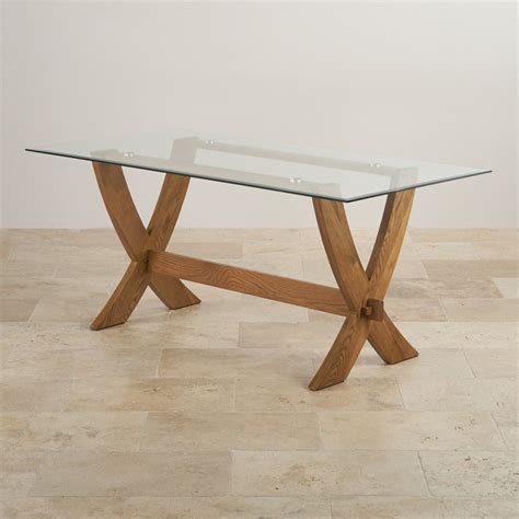 Color and saturation may vary due to lighting and. Reflection Glass Top Dining Table with Solid Oak Crossed Legs