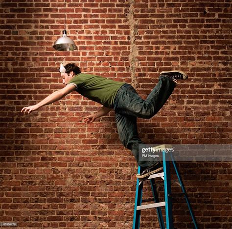 Man Falling From Ladder High-Res Stock Photo - Getty Images