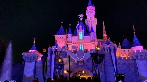 admiring the disney100 sleeping beauty castle at night — disneyland youtube