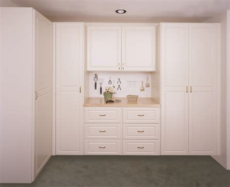 White melamine cabinets are always popular and are great for basements and utility rooms, as well as the garage. Garage shown in a White melamine with Deco doors and ...