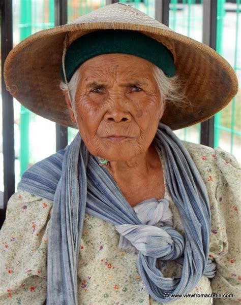 An Old Indonesian Woman She S Wearing A Traditional Cap Named Caping It Protects Her From The