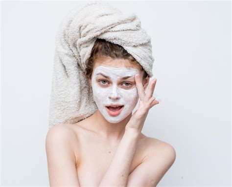 woman with bare shoulders with a towel on her head skin care facial mask stock image image of