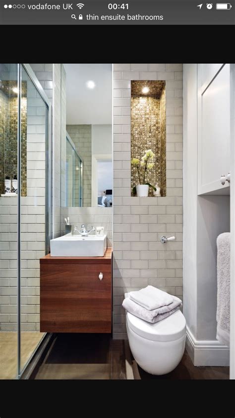 Though the space is heavy on patterns—with a bold tiled floor and a large art print—the simple black and white palette ensure it remains balanced. Pin by Jane Guest on Decorating | Tiny house bathroom, Small shower room, Ensuite bathrooms