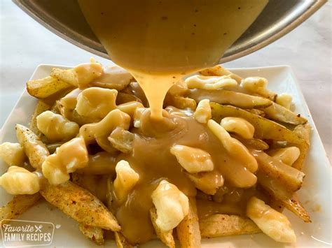Poutine A Canadian Dish Of Fries Smothered In Gravy And Cheese