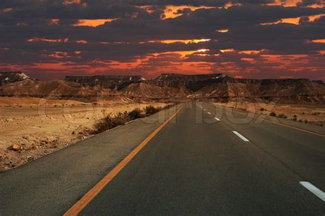 Beautiful Sunset Over Mountains And Highway Running Through Ramon