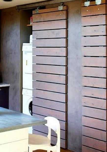 Love the durability and look of this stainless steel bottom shelf in this utility cabinet in the laundry room. 25 Ideas To Hide A Laundry Room - Amazing DIY, Interior ...