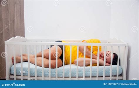 Tired Father Sleep In A Child Cot Stock Image Image Of Joyful Father