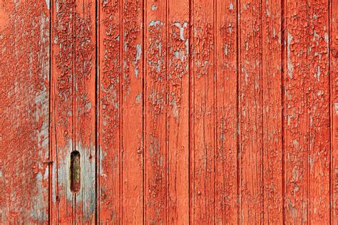 Red Barn Door Vermont With Peeling Paint By Stocksy Contributor