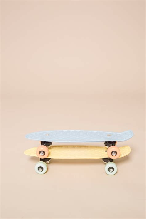 Longboards placed on beige background in studio · Free Stock Photo