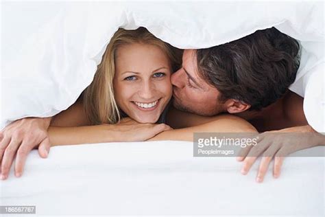 Couple In Bed Under Covers Photos And Premium High Res Pictures Getty Images