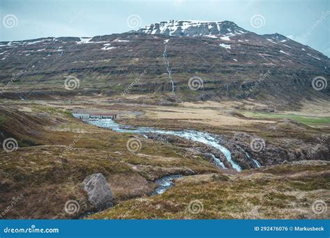 Mountain Landscape With Dam And Waterfall At Seydisfjordur Iceland