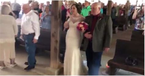 bride sings elvis while walking down the aisle her groom s reaction has everyone in tears