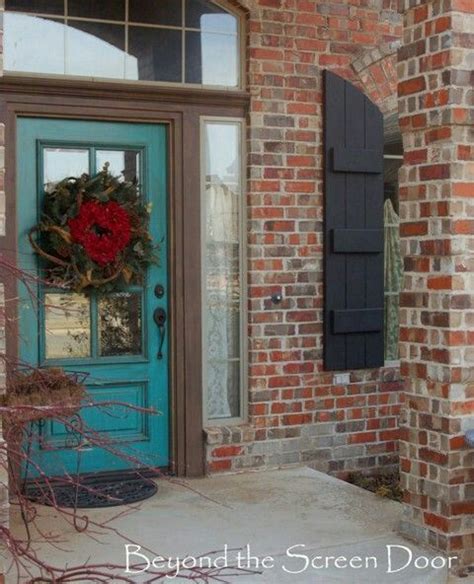 Porch with turquoise door and windows. Bright Turquoise Door & Black or Dark Grey shutters | Painted front doors, Turquoise door ...