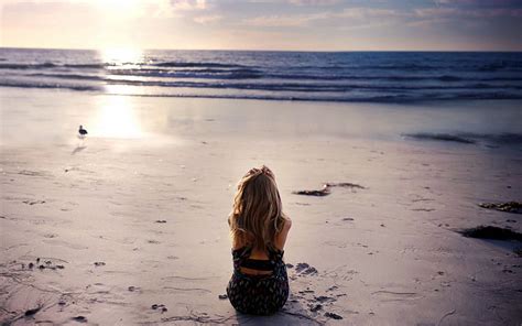 woman sits alone on the beach alone women beach hd wallpaper pxfuel