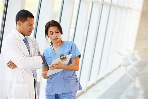 Two Nurses Talking Stock Photos Pictures And Royalty Free Images Istock