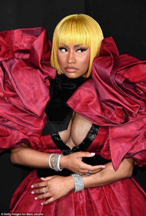 Nicki Minaj Flaunts Her Ample Cleavage In Bold And Dramatic Frock For