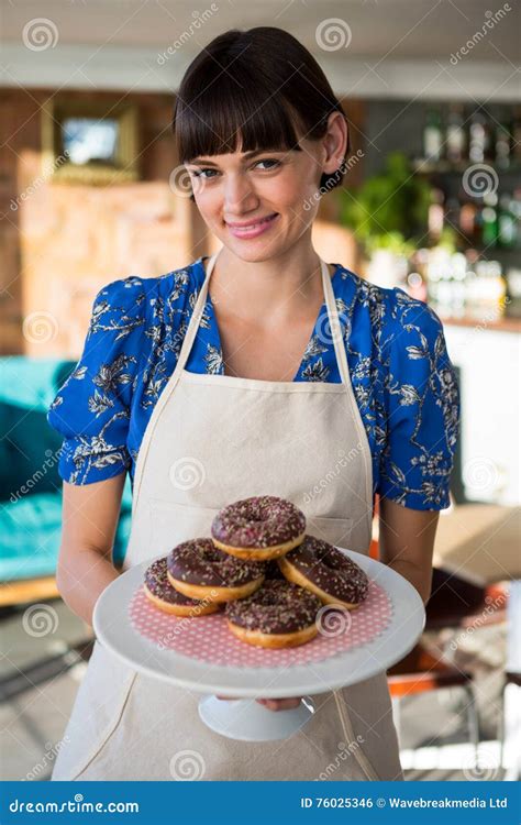 Smiling Waitress Holding A Tray Of Doughnuts Stock Photo Image Of
