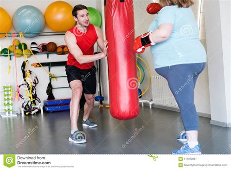 Fitness Trainer Helping Overweight Woman Stock Image Image Of Losing