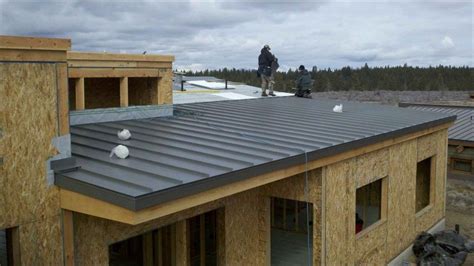 Homeowners prefer this style because it is lightweight, easy to maintain and more durable than most common materials. standing seam flat metal roof | Flat metal roof, Metal ...