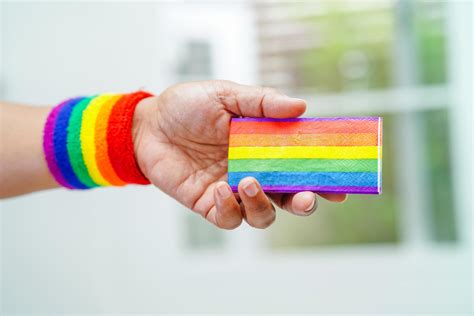 asian woman with rainbow flag lgbt symbol rights and gender equality lgbt pride month in june