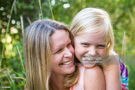 Mother And Daughter Hugging Outdoors High Res Stock Photo Getty Images