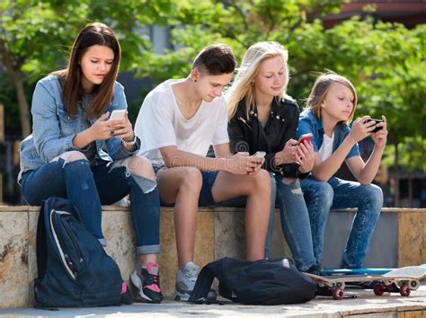 237 Teenagers Friends Playing Mobile Phones Stock Photos Free