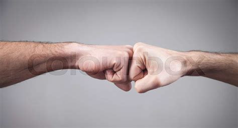 Close Up Two Fists Hitting Each Other Fight Stock Image Colourbox