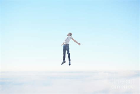 Man Floating In Sky Photograph By Tara Moore
