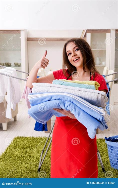 The Young Beautiful Woman Doing Laundry At Home Stock Image Image Of