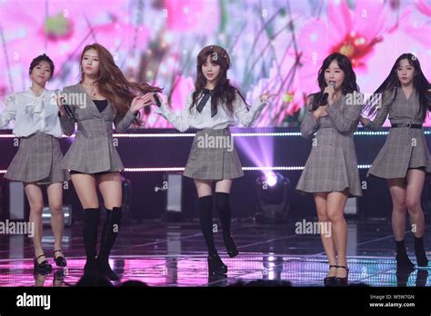 Members Of South Korean Girl Group Lovelyz Perform During The Filming Session For An Episode Of