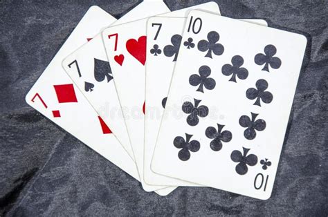 Five Playing Card S A Hand Of A Four Of A Kind Seven S And A Ten Stock