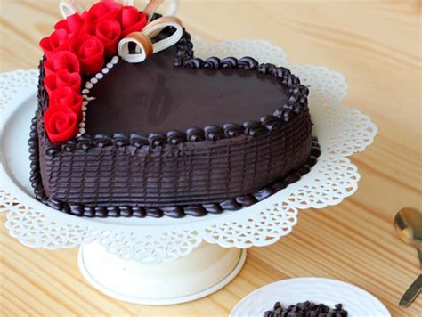 Order half a kg of black forest cake, butterscotch cake & heart shaped cakes for home delivery to your loved ones. Heart Shaped Choco Truffle Cake - Dark Magic Cake: Bakingo
