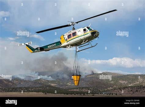 Helicopter Aerial Forest Fighting Aircraft Filling Bucket With Water