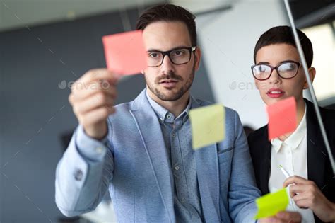 Business People Meeting At Office And Use Post It Notes To Share Idea