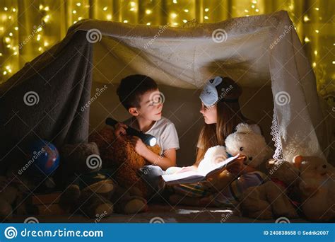 Little Children Reading Bedtime Story At Home Stock Photo Image Of