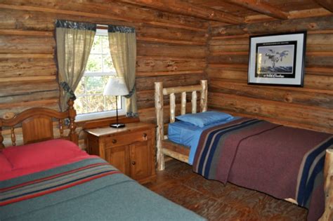 Camping facilities include tent sites, bunkhouses, cabins, and facilities include a bear line, pit outhouses, canoe rental, and a staffed ranger station. Camping Cabin near Baxter State Park, Maine