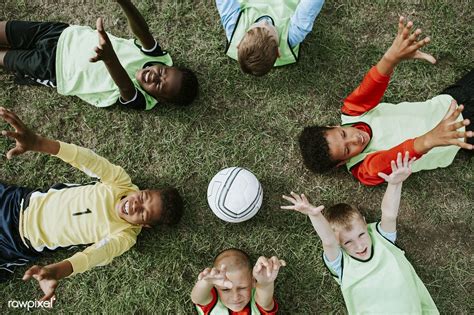 Junior Football Team Lying Around A Football Premium Image By