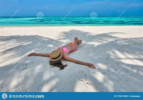 Woman In Bikini At Tropical Beach Under The Palm Tree Stock Image