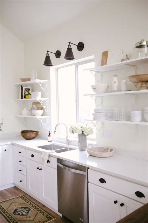 All white cabinetry in the kitchen is one of the easiest ways to brighten your home and make it feel more open. how to: Minimalist Kitchen Styling | Kitchen styling ...