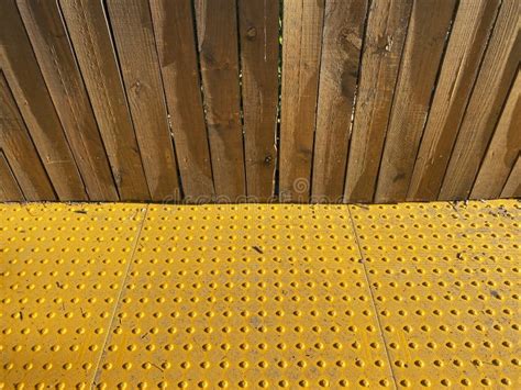 Sidewalk Crossing Yellow Raised Bumps Caution Stripe Wood Fence Walkway
