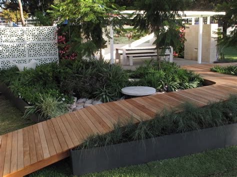 The benefits of a sloped backyard or sloped yard are more then simple plants' layouts! Easy visitor access with a ramped #deck through the garden | decks in 2019 | Wheelchair ramp ...