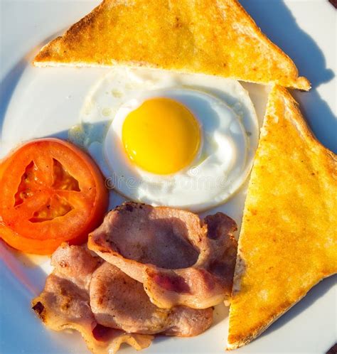 A Breakfast Plate Of Egg And Bacon Stock Image Image Of Wholesome