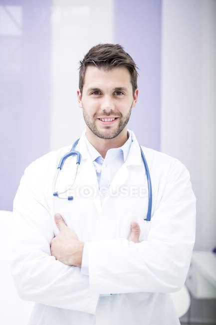 Portrait Of Smiling Doctor — Man Indoors Stock Photo 164883806
