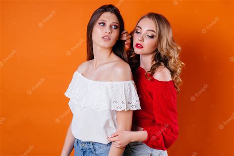 Premium Photo Two Young And Beautiful Girls Posing