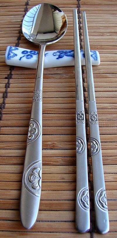 How to hold chopsticks quick summary: A stainless steel spoon (sutgarak, 숟가락) and a pair of ...